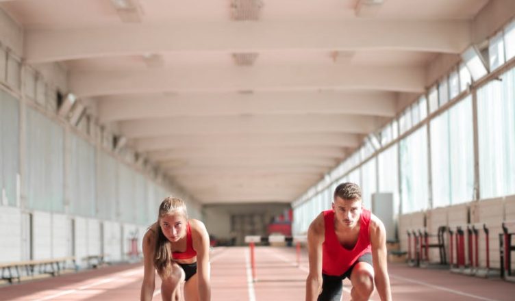 young athletes preparing for running in training hall